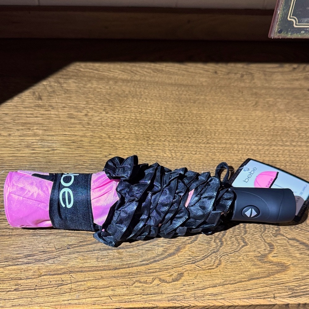 Bebe Pink and black fringe Compact Umbrella.